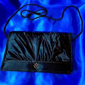 Vintage dressy black clutch with shimmering accent, hideable strap